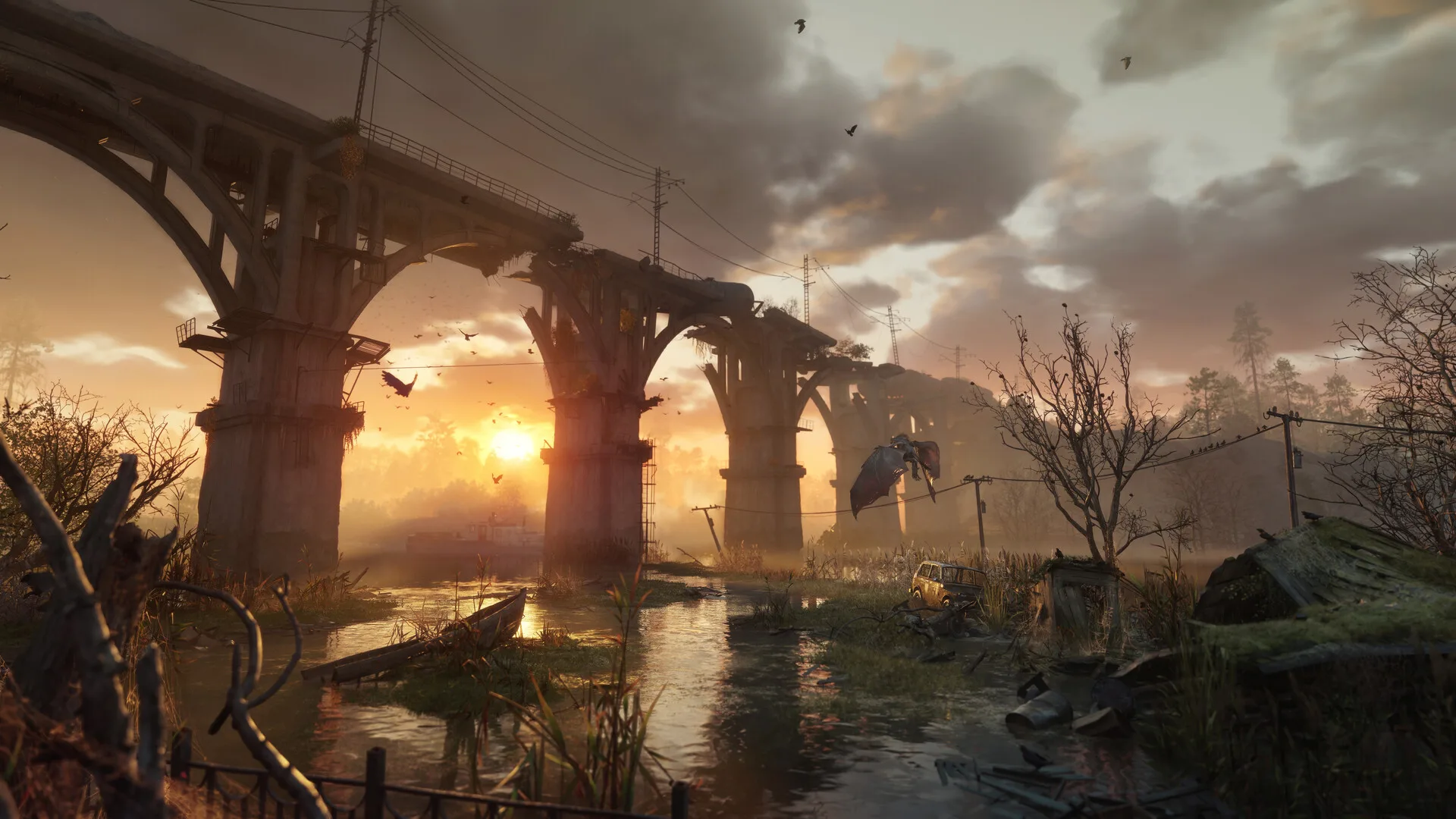 Sunset view of a ruined bridge over a frozen river